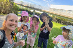 Group of kids making wishes outdoors