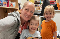 Children smiling in cubbie room